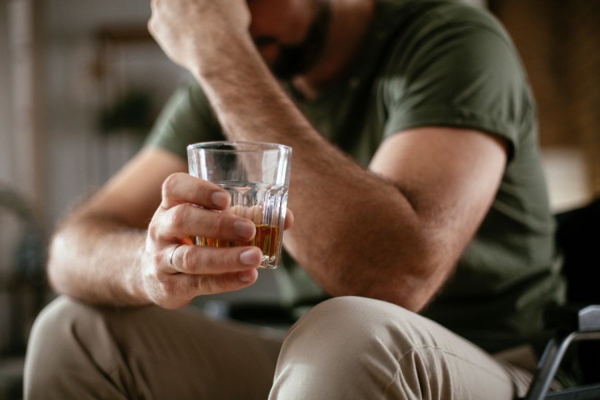 Professional pouring a drink at home after work