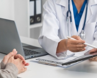 Doctor discussing esperal implant treatment with a patient in a London clinic