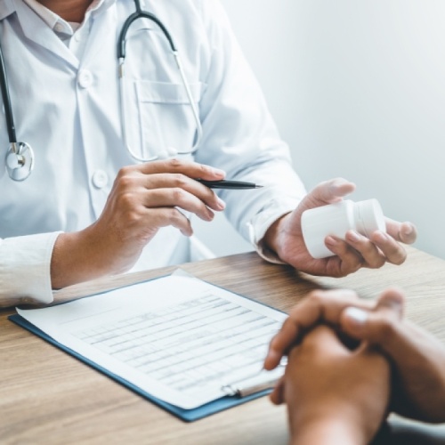 Doctor explaining alcohol implant treatment to a patient during a consultation